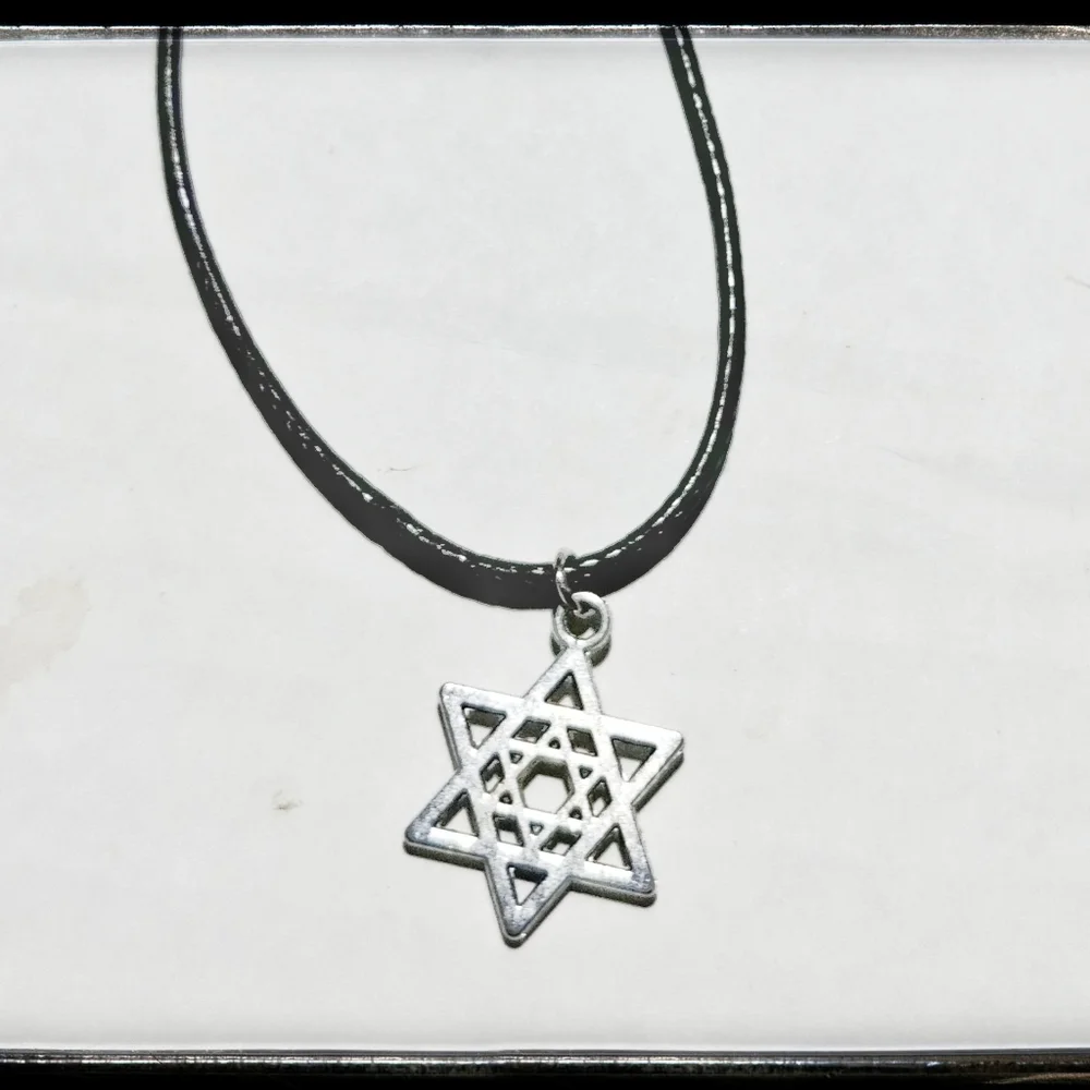 Silver Tone Star with Black Cord Necklace